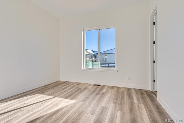 empty room featuring light hardwood / wood-style floors