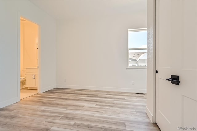 unfurnished room featuring light wood-type flooring