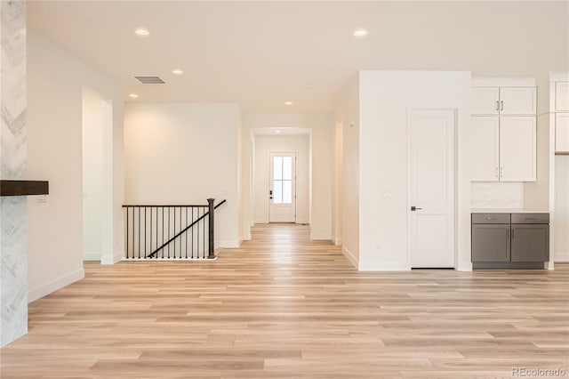 corridor with light wood-type flooring