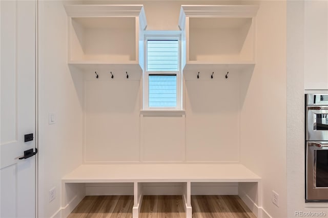 mudroom with wood-type flooring