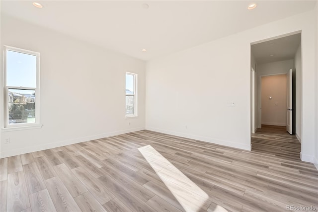 spare room with light wood-type flooring