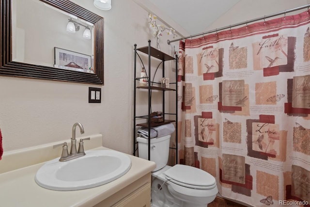 bathroom with vanity, a shower with curtain, toilet, and lofted ceiling