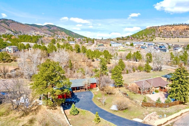 birds eye view of property featuring a mountain view