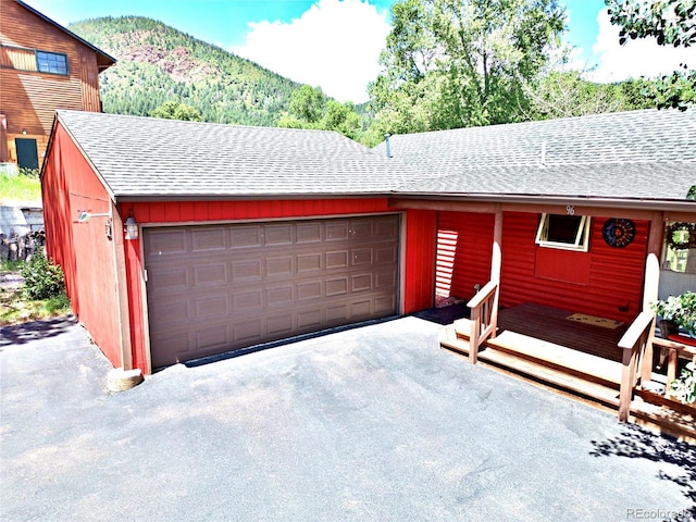 96 Greeley Blvd, Palmer Lake, CO 80133 - garage featuring a mountain view