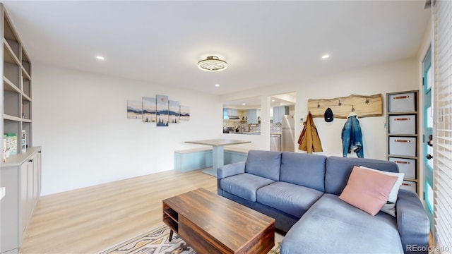 living room with recessed lighting and light wood finished floors