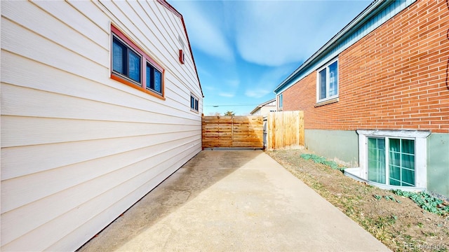 view of side of home with fence