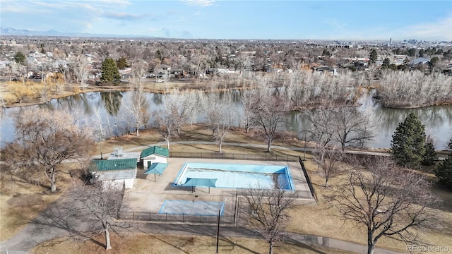 view of pool featuring a water view