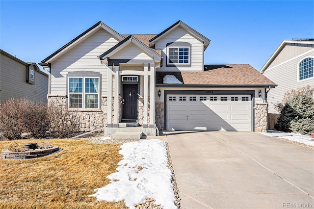 view of front of house with a garage, stone siding, roof with shingles, and concrete driveway