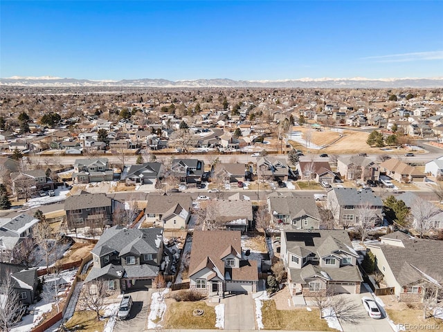 drone / aerial view featuring a residential view and a mountain view