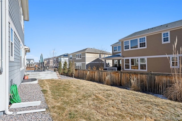 12264 Olive Way, Thornton, CO 80602 - fenced backyard featuring a residential view and a patio area