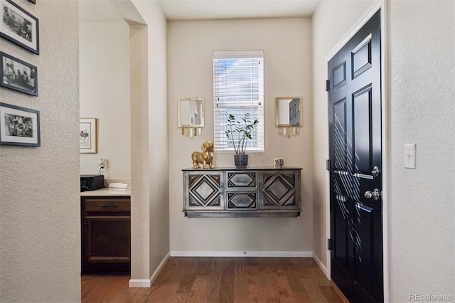 12264 Olive Way, Thornton, CO 80602 - foyer featuring dark wood finished floors and baseboards