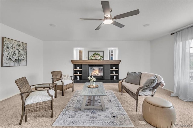 1385 Candleglow St, Castle Rock, CO 80109 - living area featuring light carpet, a ceiling fan, a fireplace, and baseboards