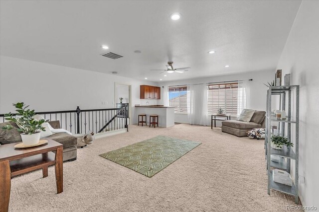 1385 Candleglow St, Castle Rock, CO 80109 - living area featuring light colored carpet, recessed lighting, and a ceiling fan