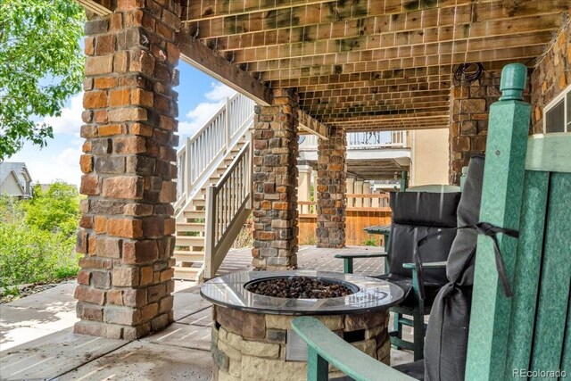1385 Candleglow St, Castle Rock, CO 80109 - view of patio / terrace with a fire pit and stairway