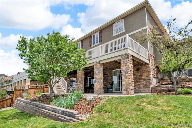 1385 Candleglow St, Castle Rock, CO 80109 - back of property featuring a wooden deck and stucco siding