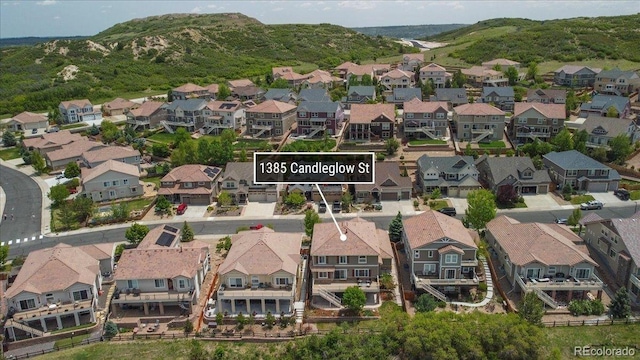 1385 Candleglow St, Castle Rock, CO 80109 - aerial view of property and surrounding area featuring mountains and nearby suburban area