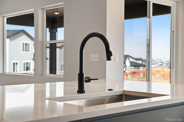 details featuring light countertops and a sink