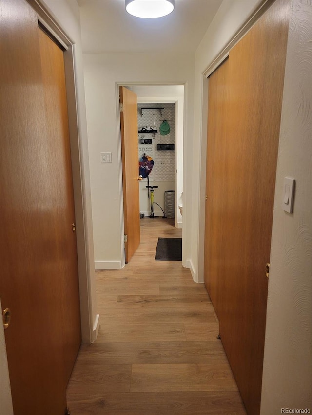 hallway featuring light wood-type flooring