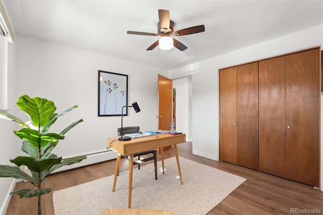 office space with dark hardwood / wood-style floors and ceiling fan