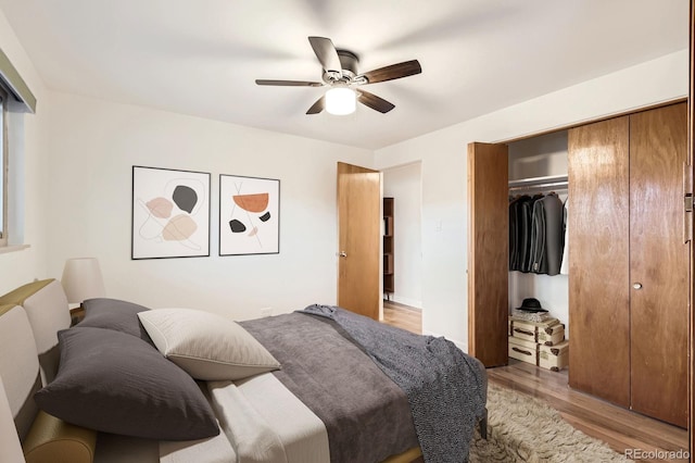 bedroom with a closet, ceiling fan, and light wood-type flooring