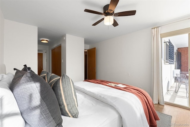bedroom featuring access to outside and a ceiling fan