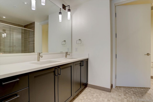 bathroom featuring vanity and an enclosed shower