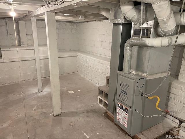 unfinished below grade area featuring visible vents and heating unit