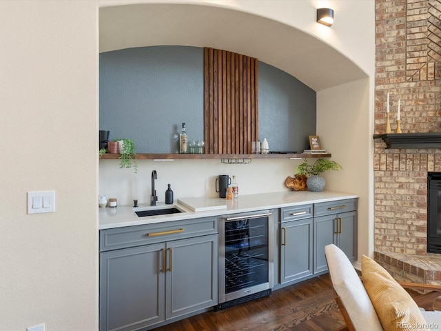 8425 Green Island Cir, Lone Tree, CO 80124 - indoor bar with beverage cooler, dark wood finished floors, and arched walkways