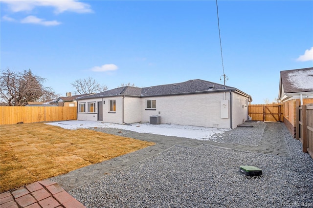 back of property featuring a lawn, a patio area, and central air condition unit