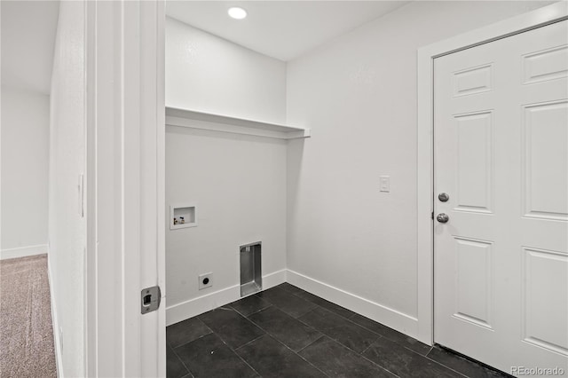 washroom with dark tile patterned flooring, hookup for a washing machine, and hookup for an electric dryer