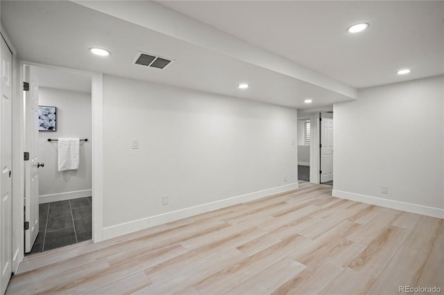 basement featuring light hardwood / wood-style flooring