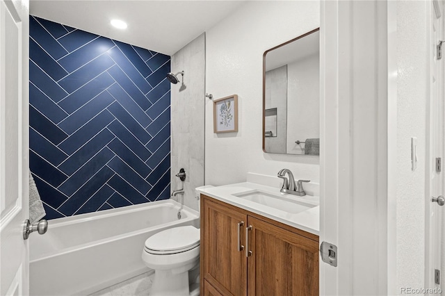 full bathroom featuring vanity, toilet, and tiled shower / bath