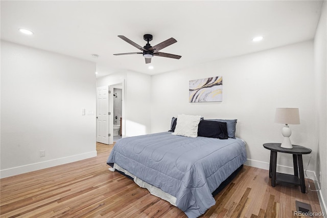 bedroom featuring hardwood / wood-style flooring and ceiling fan