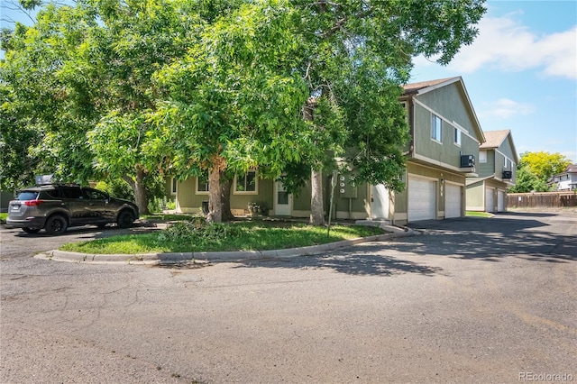 1155 S Fairplay Cir Unit D, Aurora, CO 80012 - view of front facade with a garage and asphalt driveway
