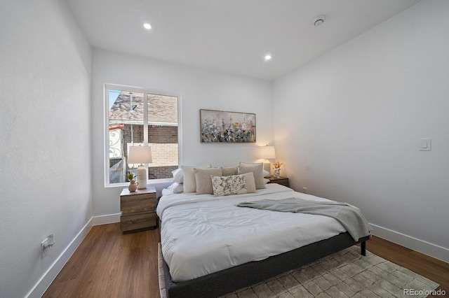 bedroom with hardwood / wood-style flooring