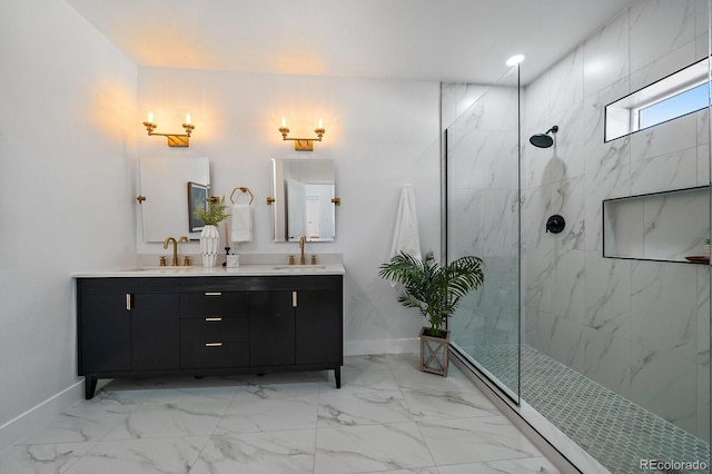 bathroom featuring tiled shower and vanity