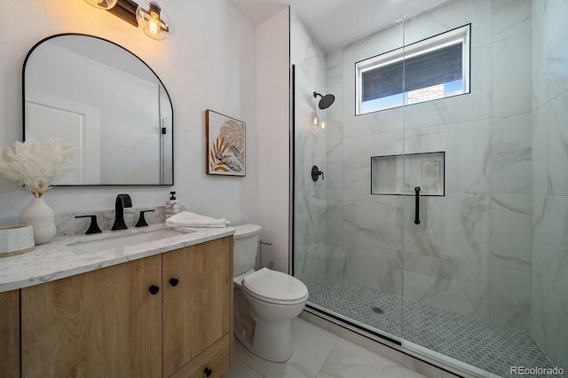 bathroom with vanity, a shower with shower door, and toilet