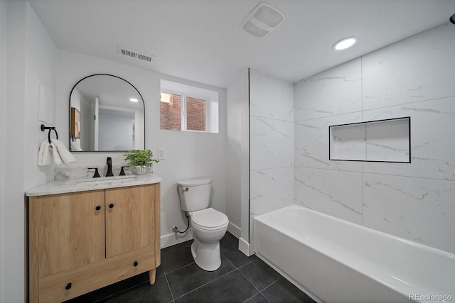 full bathroom with tiled shower / bath combo, vanity, tile patterned floors, and toilet