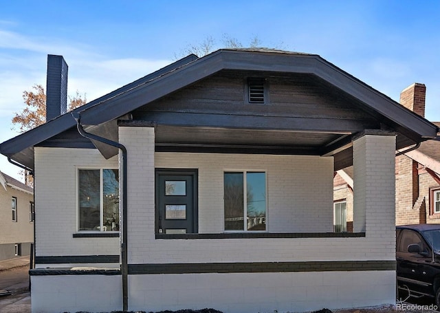 view of side of home featuring a porch