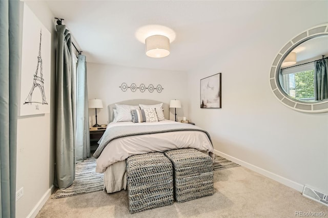 bedroom featuring light colored carpet