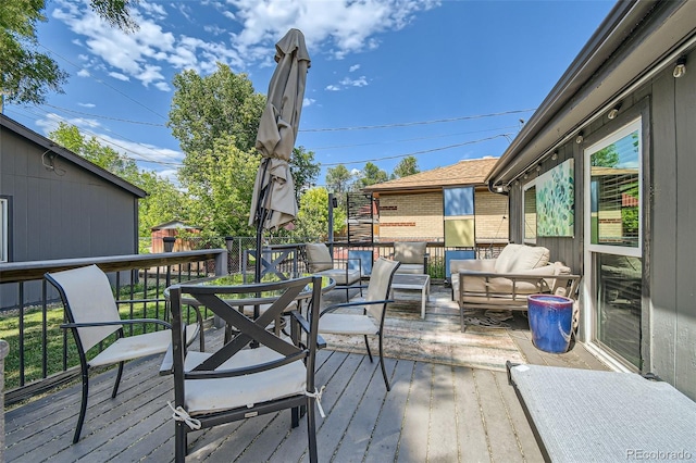 wooden deck with an outdoor hangout area