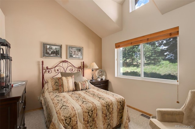 bedroom with multiple windows, baseboards, visible vents, and carpet floors