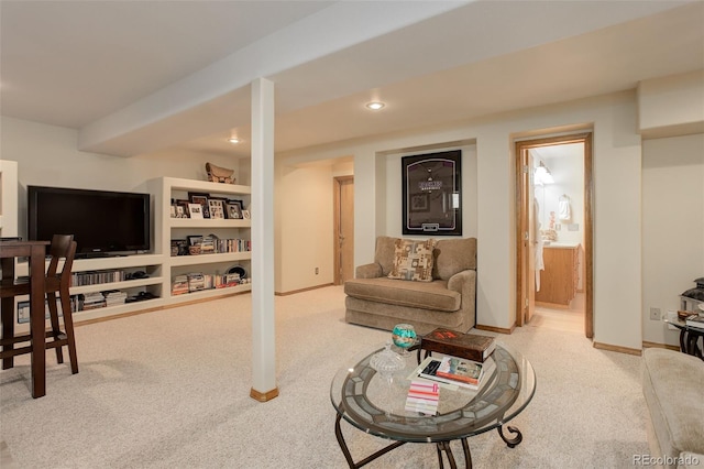 carpeted living area featuring recessed lighting and baseboards