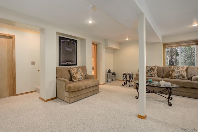 carpeted living area featuring recessed lighting and baseboards