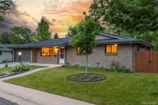 2644 S Krameria St, Denver, CO 80222 - ranch-style house with an attached garage, brick siding, and driveway