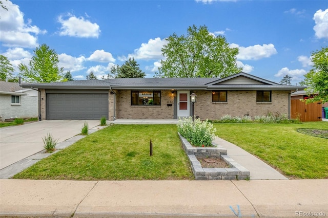 2644 S Krameria St, Denver, CO 80222 - ranch-style home with a garage, a front yard, concrete driveway, and brick siding