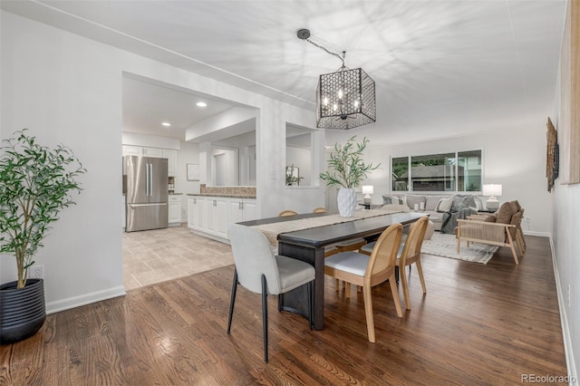 2644 S Krameria St, Denver, CO 80222 - dining space with a chandelier, recessed lighting, wood finished floors, and baseboards