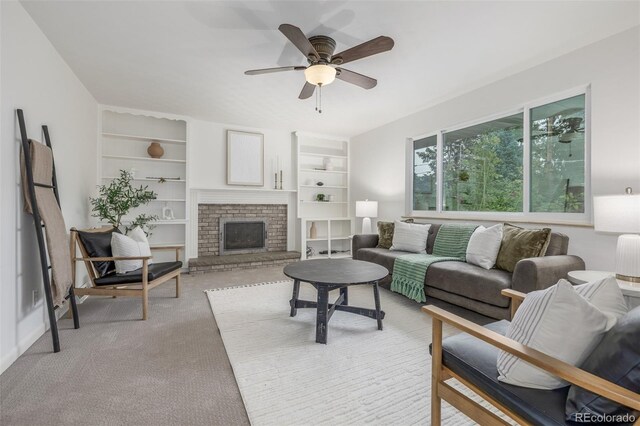 2644 S Krameria St, Denver, CO 80222 - living room with built in shelves, light colored carpet, a brick fireplace, and a ceiling fan