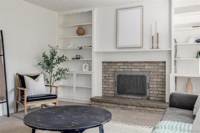 2644 S Krameria St, Denver, CO 80222 - living room featuring built in shelves, carpet, and a brick fireplace