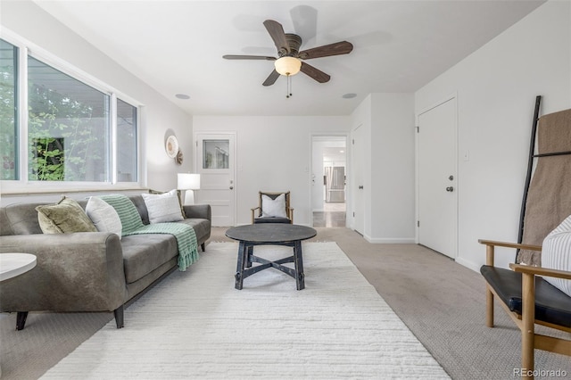 2644 S Krameria St, Denver, CO 80222 - living area with light carpet, a ceiling fan, and baseboards